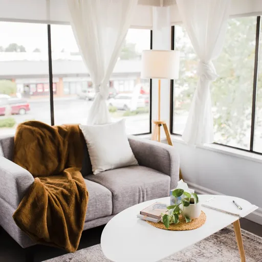 Bright, calming therapy office seating area with natural light